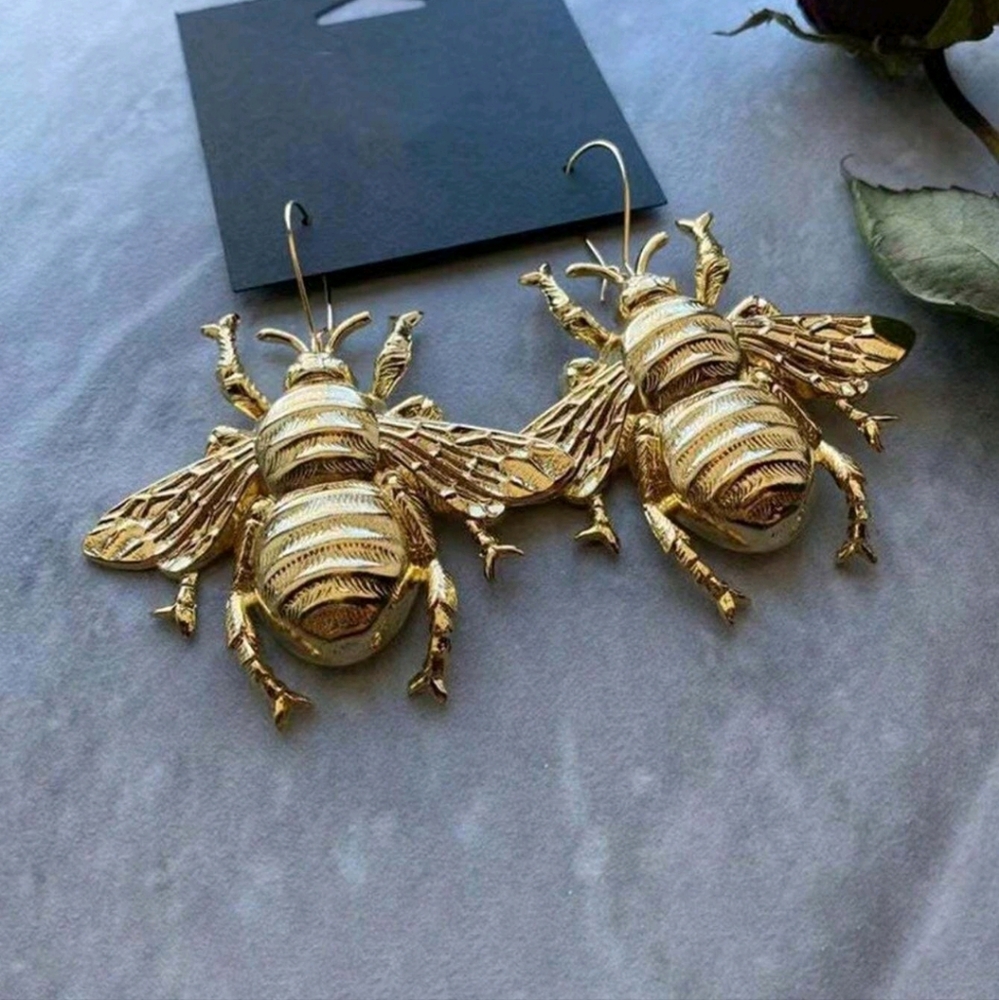 Oversized gold bee dangle earrings